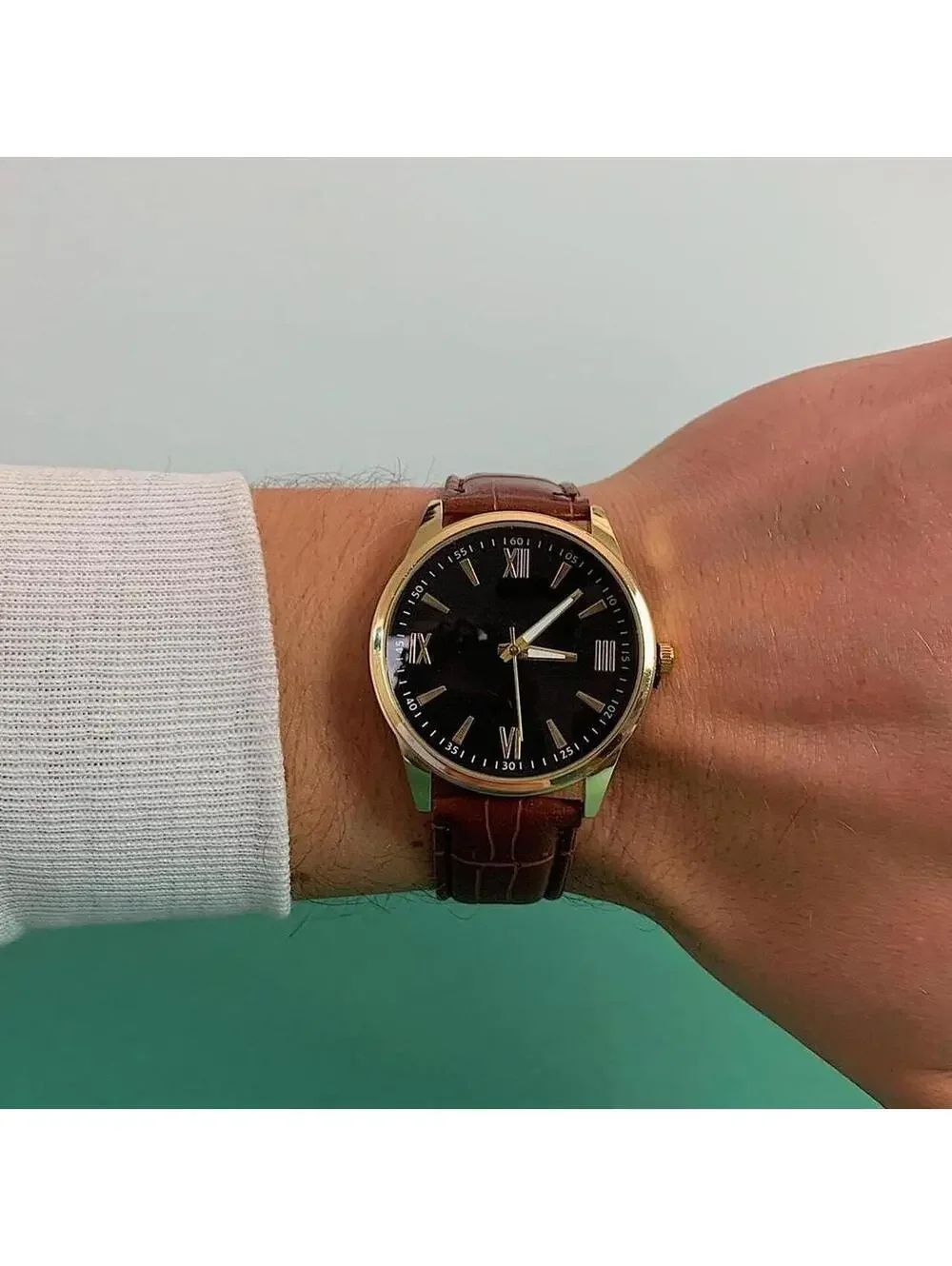 Minimalistic Black essential vintage style gold and leather style band watch. 9
